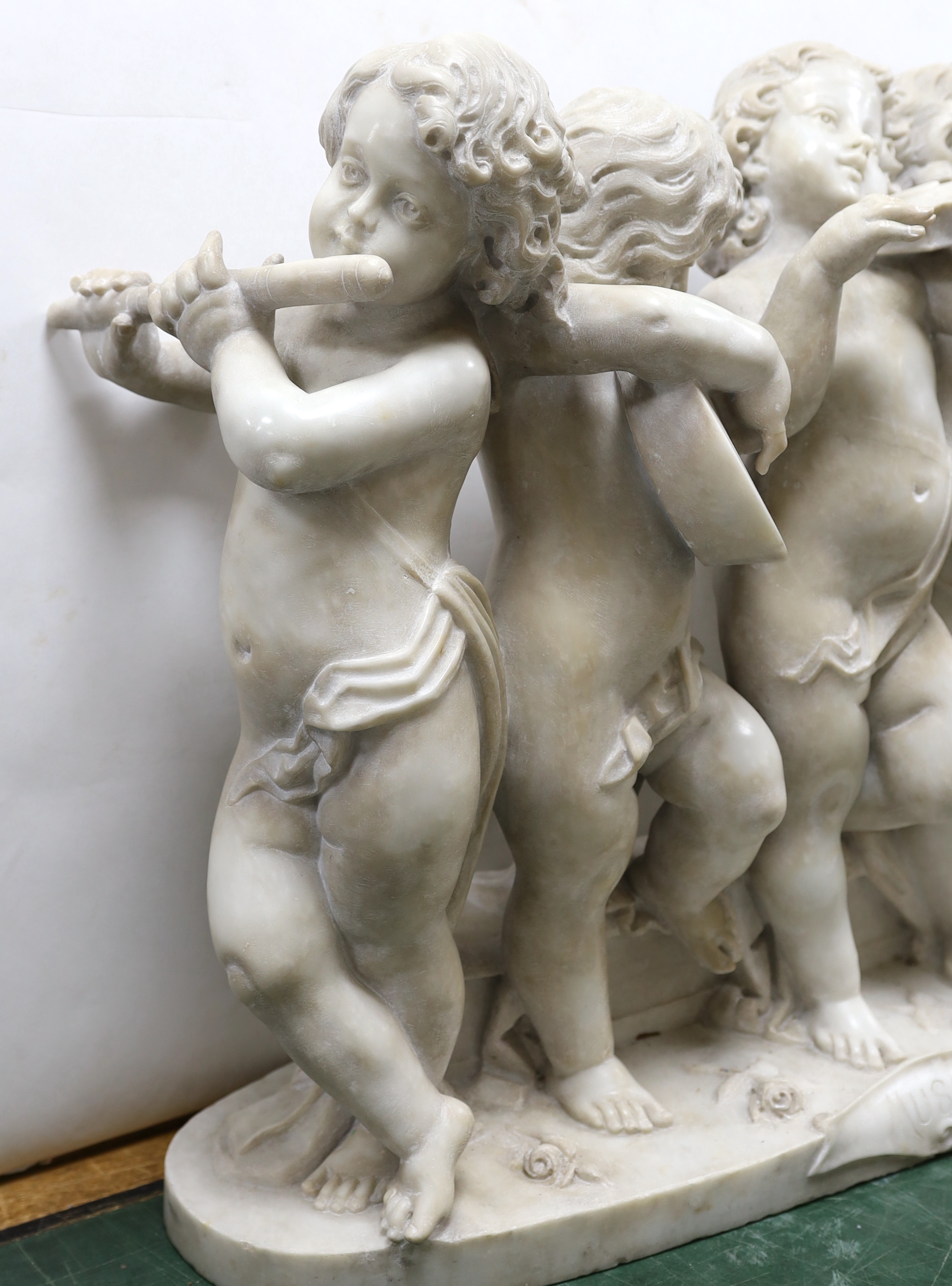 After the Ferdinando Vichi Gallery. An Italian white Carrara marble group 'Musica', Please note this lot attracts an additional import tax of 5% on the hammer price